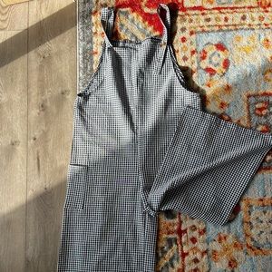 Black and white checkered overalls with wide leg bottoms